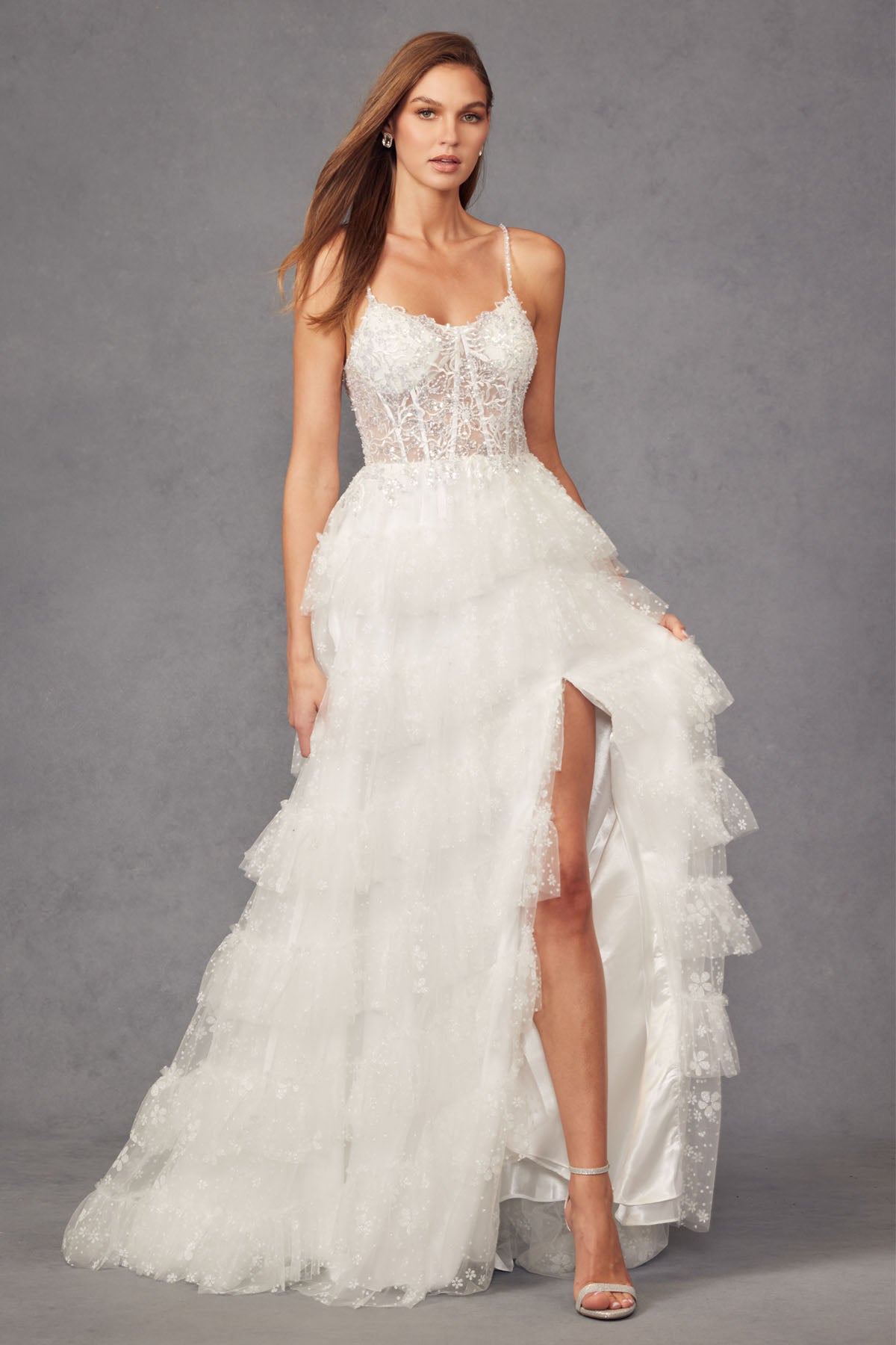 JT24-2464AW Lace Corset Beaded Gown With Sparkle Glitter Fabric Ruffle Skirt Slit And Satin Bow Belt Bridal Gown